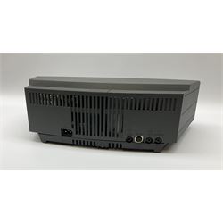 A Bose Wave music system, model AWRCC5, with remote control. 