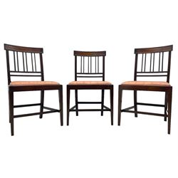 Early 20th century Regency design mahogany tilt-top table, circular top with edge banding, supported by a central turned pedestal with four reeded sabre supports terminating in castors; six chairs with pink upholstered drop in seats (7)