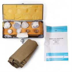 Pair of mid 20th century Russian Helios PNB-2 military observation binoculars, no. 40149, each 'Big Eye' lens 13cm in diameter, with 80 degrees vertical elevation, 360 degrees rotation, spirit level to centre of body, contained in wooden stow case with service manual, canvas cover, two lens caps, a small latched metal tin containing lenses and accessories and on adjustable wooden tripod painted green with pointed feet,  with a small latched metal tin containing eight lenses and accessories