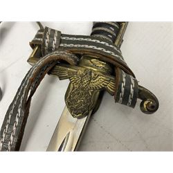 WW2 German Army Prinz Eugen Pattern Officers Dress Sword by Carl Eickhorn, the 80.5cm slightly curving fullered blade with makers name to the ricasso, gilt brass hilt with eagle to the cross-piece and relief of oakleaves to the ferrule, Prinz Eugen style down winged eagle to the pommel of the backstrap; grip retains the original wire binding; in original black painted scabbard with single hanging ring, leather hanger marked 'RZM M5/71 OLC' and silvered knot L97cm overall