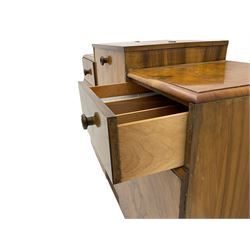 Art Deco walnut cocktail sideboard, the raised centre with hinged compartment, two drawers and two cupboards