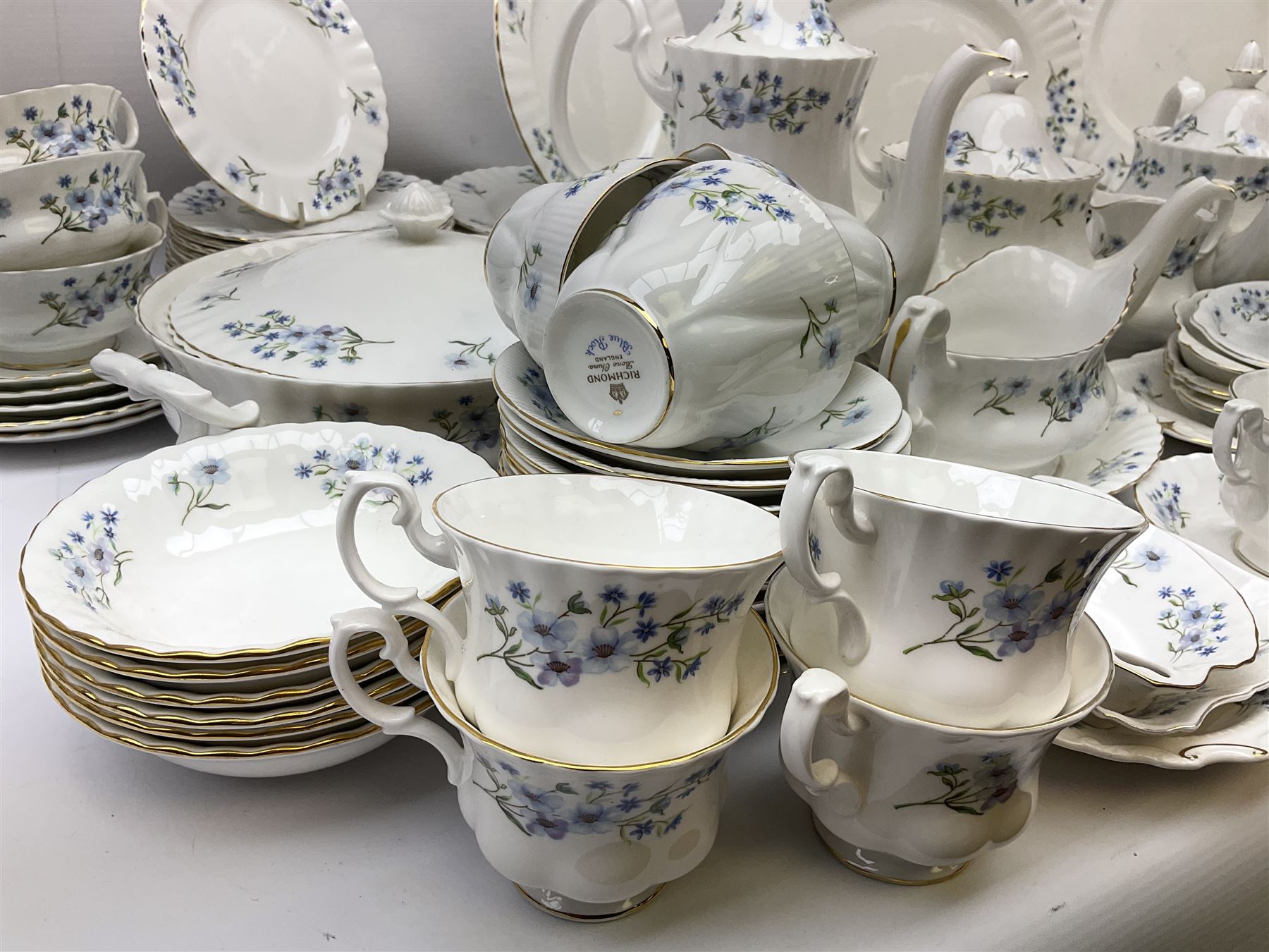 Extensive Richmond Blue Rock pattern part tea and dinner service, to include seven dinner plates, nine smaller plates, three lidded twin handled tureens, two teapots and two coffee pots, eleven bowls, cake stand, six twin handled soup bowls and saucers, six teacups, four coffee cups, milk jugs, sucrier, cake plate, salt and pepper shakers, other plates, dishes, bowls, side plates and many spares etc