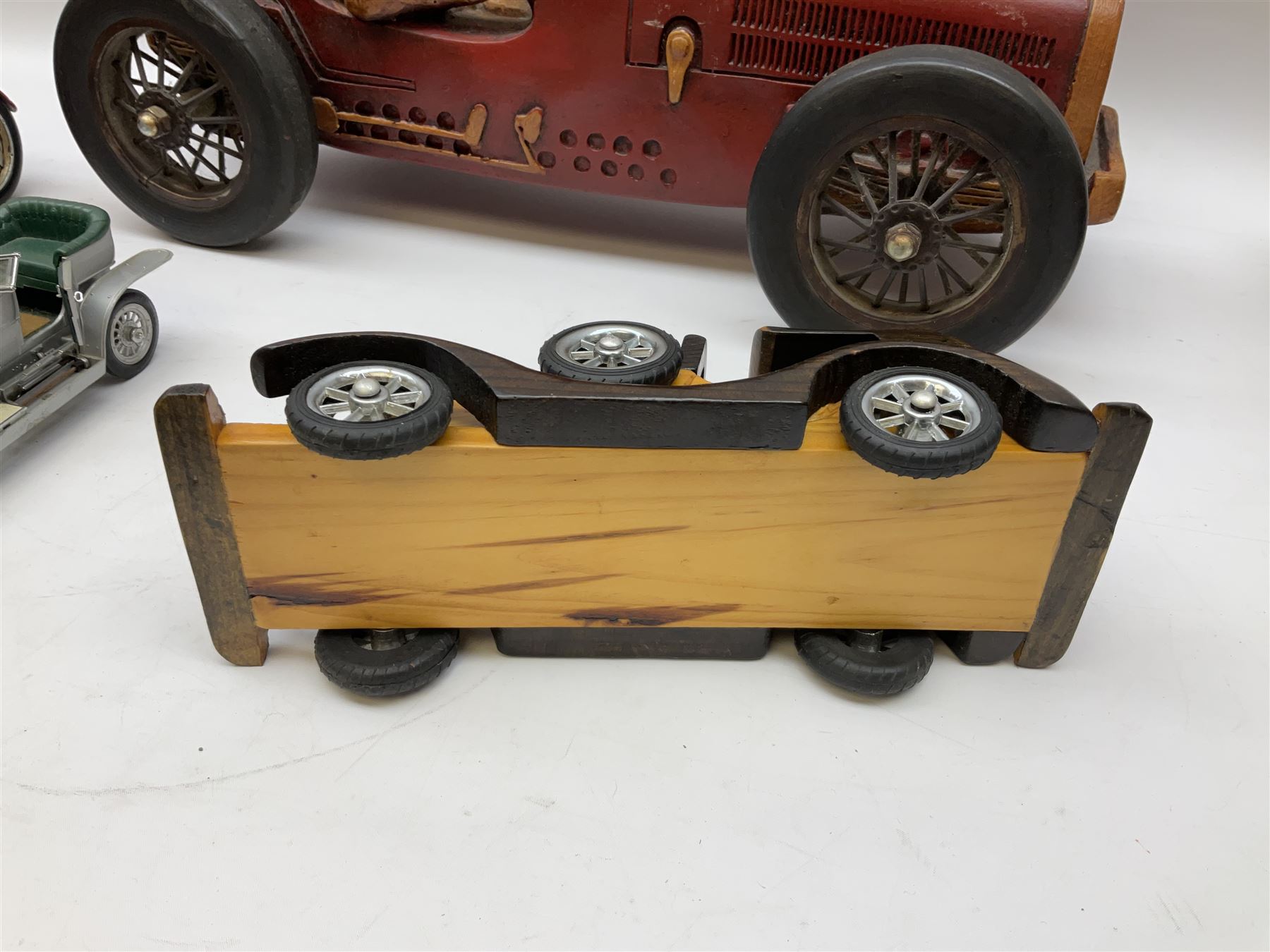 Four Franklin Mint Precision Models, one with hardwood body; large reproduction model of a vintage racing car L52cm; and four other modern metal/wooden models of vintage cars; all unboxed (9)