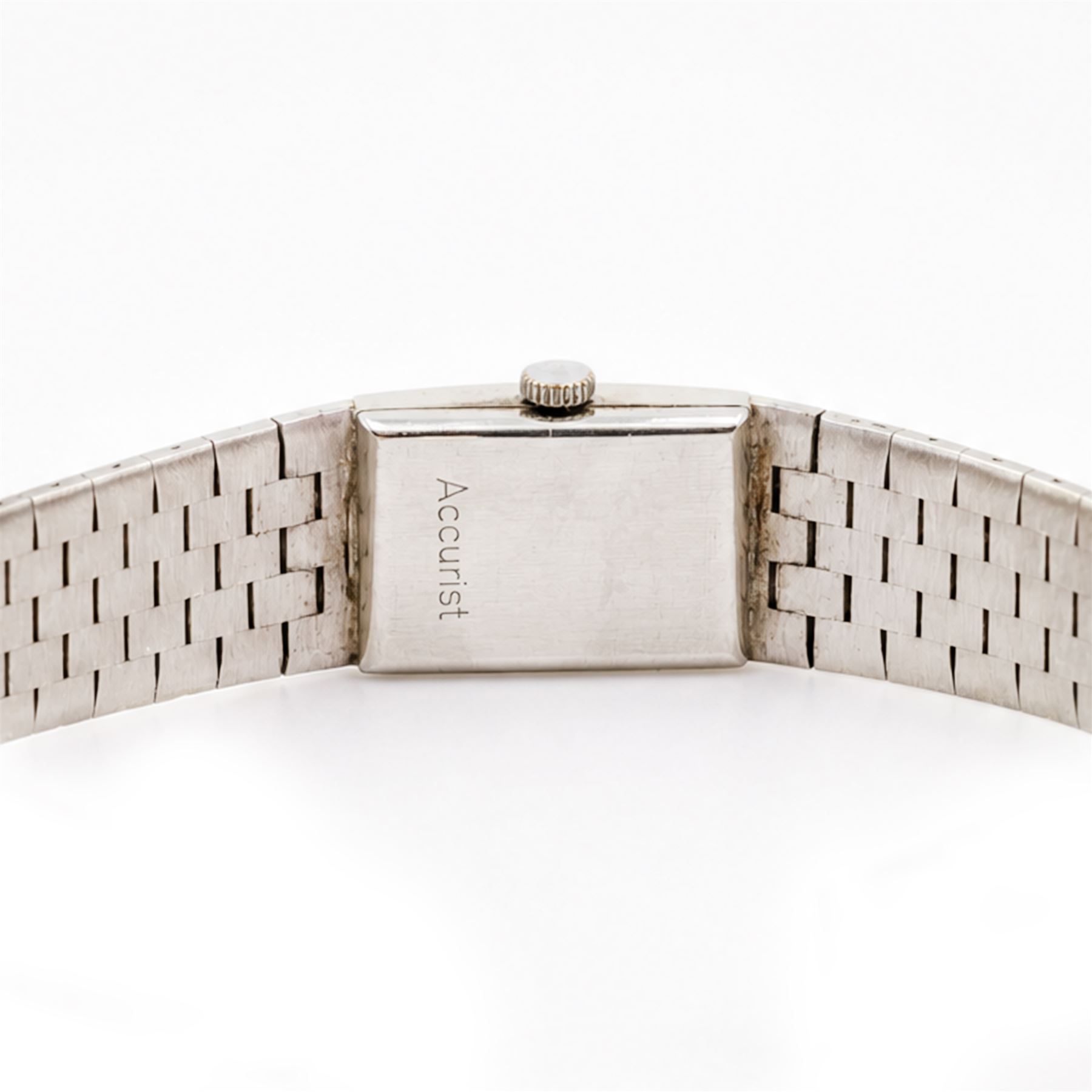 Accurist ladies 9ct white gold manual wind wristwatch, silvered dial with baton hour markers, on integral 9ct bracelet, London 1969