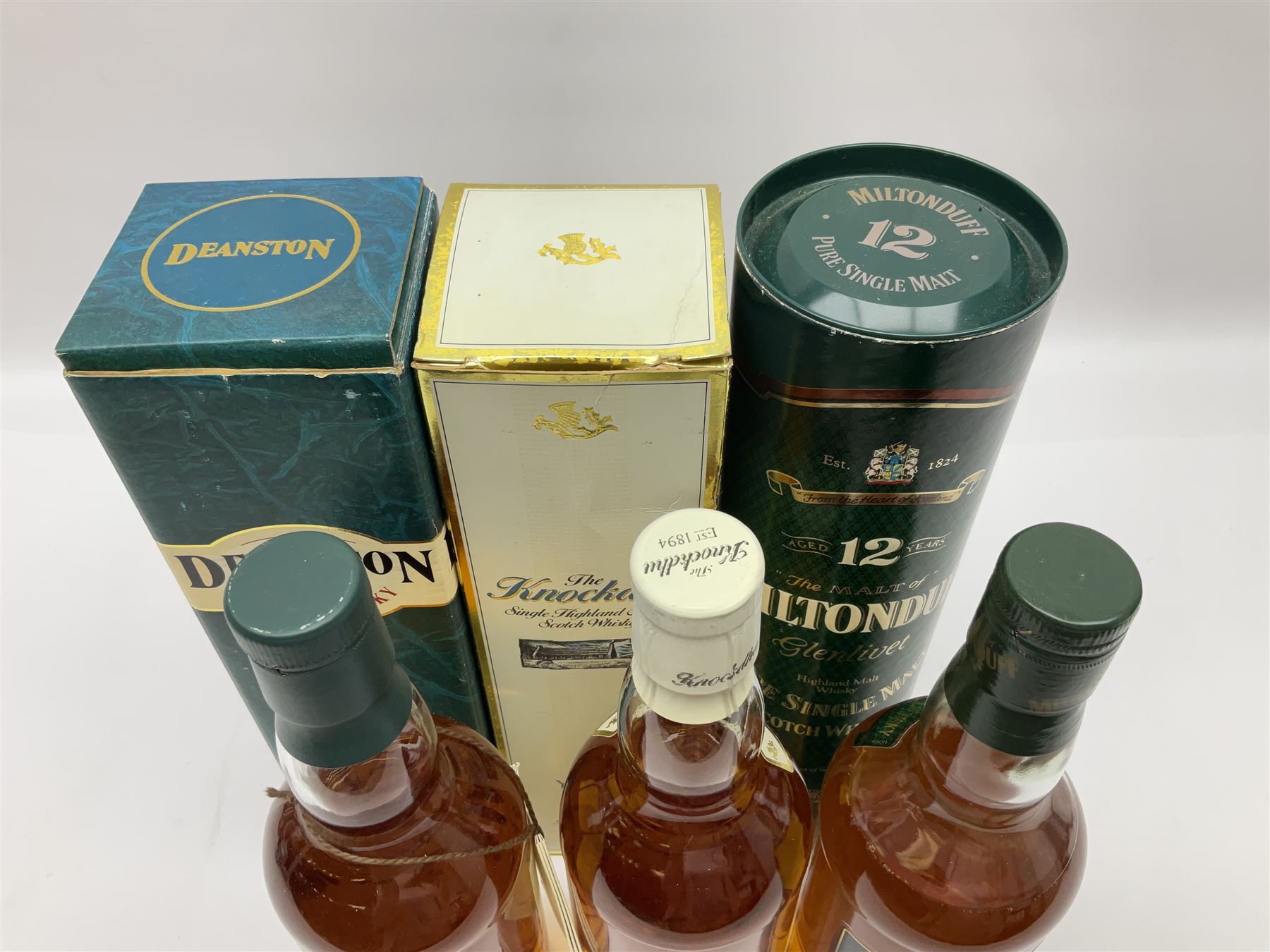 Knockdhu, 12 year old, single malt Scotch whisky, 70cl, 40% vol, Miltonduff, 12 year old, single malt Scotch whisky, 70cl, 43% vol and Deanston, 12 year old, single malt Scotch whisky, 70cl, 40% vol (3)