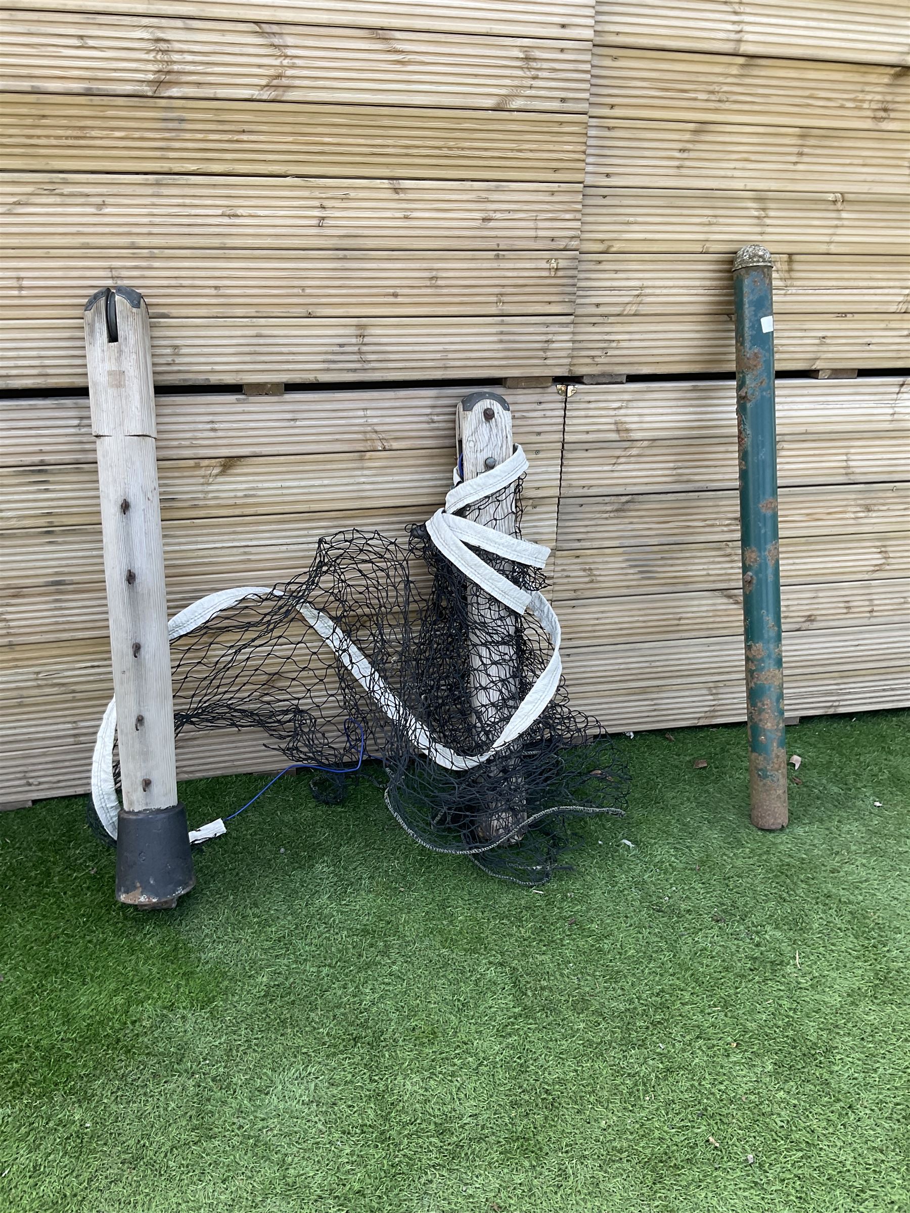 Pair of Edwardian cast iron and wood tennis posts, with net - THIS LOT IS TO BE COLLECTED BY APPOINTMENT FROM DUGGLEBY STORAGE, GREAT HILL, EASTFIELD, SCARBOROUGH, YO11 3TX