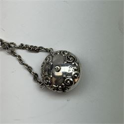 Victorian and later silver chatelaine, the shaped and foliate pierced clasp with embossed oval panel of a courting couple, hallmarked Levi & Salaman, Birmingham 1899, supporting six accessories on five chains: a circular mirror embossed with putti, hallmarked Henry Matthews, Birmingham 1911, pencil holder engraved with foliate scrolls, hallmarked Francis Webb, Birmingham 1914, conical scent bottle decorated with bamboo, (unmarked but testing as silver), aide memoire embossed with putti, hallmarked Samuel M Levi, Birmingham 1911, tape measure of compressed spherical form, hallmarked Henry Matthews, Birmingham 1899, and a purse with embossed putti, hallmarked Birmingham 1909, makers mark worn and indistinct, at longest point L31cm

