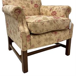 Peter Dudgeon - Georgian design mahogany framed armchair, shaped cresting rail over sprung back and seat flanked by rolled arms, upholstered in floral patterned fabric with matching seat cushion, on square supports joined by stretchers
Provenance: From the Estate of the late Dowager Lady St Oswald