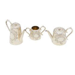 Edwardian miniature silver tea service, comprising tray, coffee pot, tea pot, milk and sugar bowl, all with engraved decoration, hallmarked J & J Maxfield Ltd, Sheffield 1903, together with a pair of miniature silver cups and saucers, hallmarked Cornelius Desormeaux Saunders & James Francis Hollings (Frank) Shepherd, Birmingham 1904, coffee pot H5cm