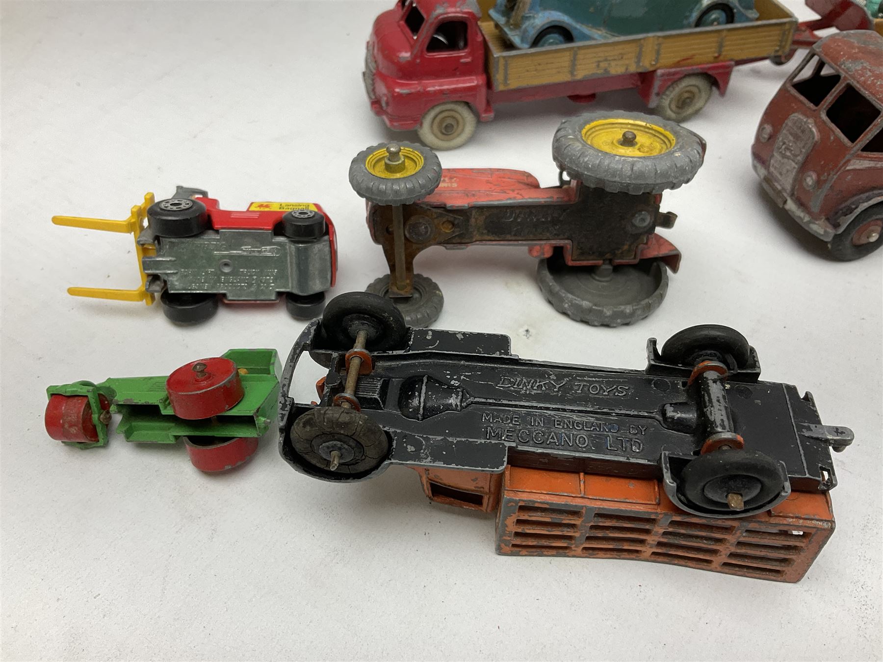 Dinky - sixteen unboxed and playworn die-cast models including Foden lorry, Big Bedford lorry with Halesowen Farm Trailer, Thunderbolt land speed record car, Spirit of the Wind racing car, market garden truck, Bedford tipper, station wagon, tanker, motorcycle combination etc; two Corgi models; and five Matchbox/Lesney models (23)