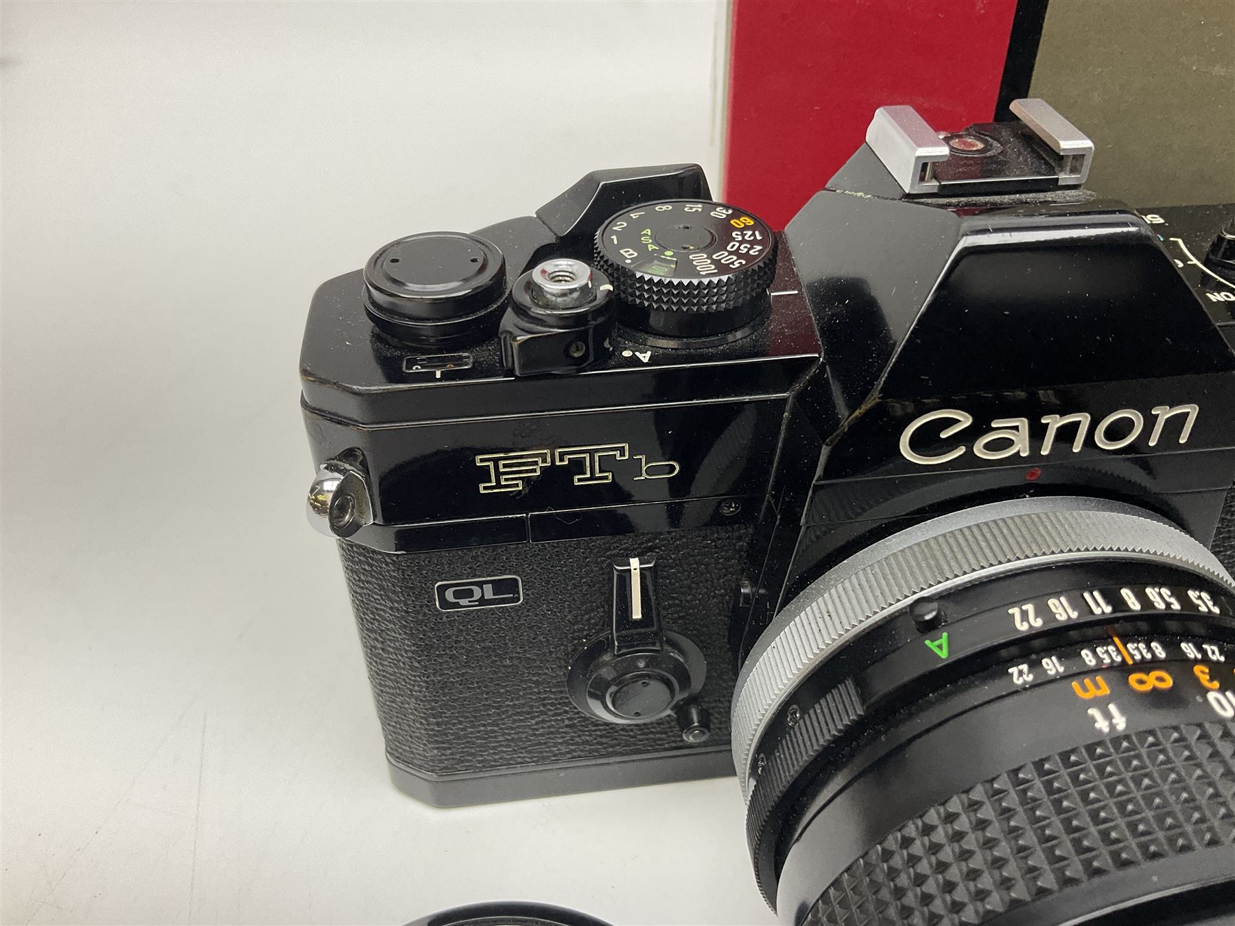 Canon FTb camera body, serial no. 715838, with 'Canon FD 50mm 1:1.8' lens, serial no. 207888, in original box, together with Canon FTb camera body, serial no. 557817, with 'Canon FD 35mm 1:3.5 S.C' lens, serial no. 126210 and Canon EX Auto camera body, serial no. 296244 with 'Canon EX 50mm 1:1.8' lens, serial no. 380869  