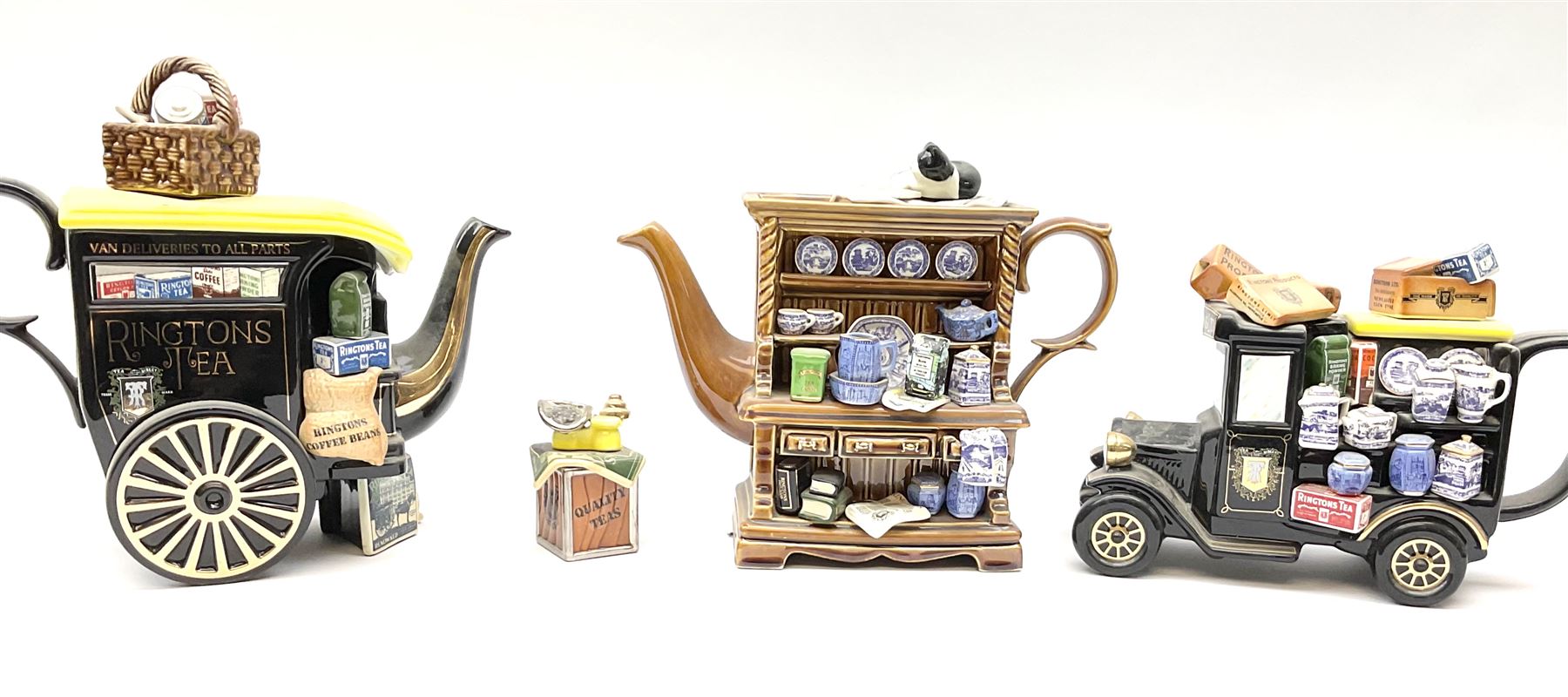 Three Ringtons novelty teapots, comprising The Ringtons Van teapot, the Tea Merchant teapot, and Millenium Celebration teapot. 