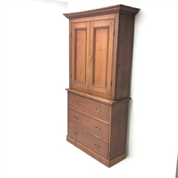 19th century pine press cupboard, projecting cornice above two doors enclosing fitted interior, three drawers, plinth base, W105cm, H197cm, D36cm  