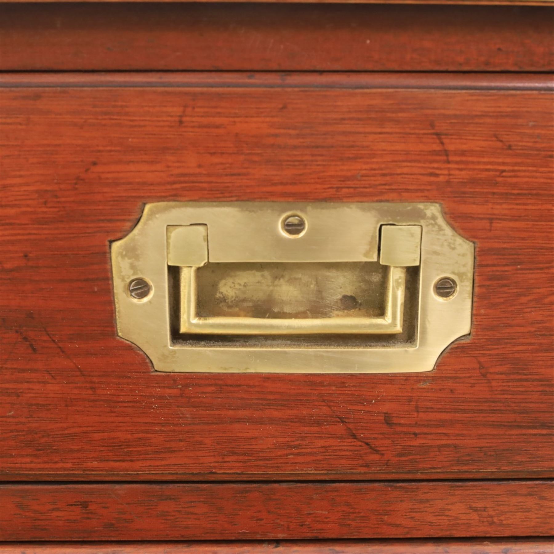 Military campaign style mahogany writing desk, inset gilt-tooled green leather writing surface, fitted with five drawers with recessed brass handles, brass corner mounts and protective bindings, on square tapering legs