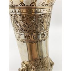 Late 19th century Danish silver drinking horn and cover, the body with hexagonal and beaded finial, raised upon two talon feet and further scroll foot, chased with scrolling foliate and zoomorphic bands, the detachable domed cover with conforming decoration surmounted by a figure holding a hammer, the cover interior impressed with maker's mark (partly worn and indistinct), alongside Danish Three Towers mark for 1881, with the Assay Master mark for Simon Groth (1863-1904), H23.5cm, weight 14.75 ozt (459 grams)

