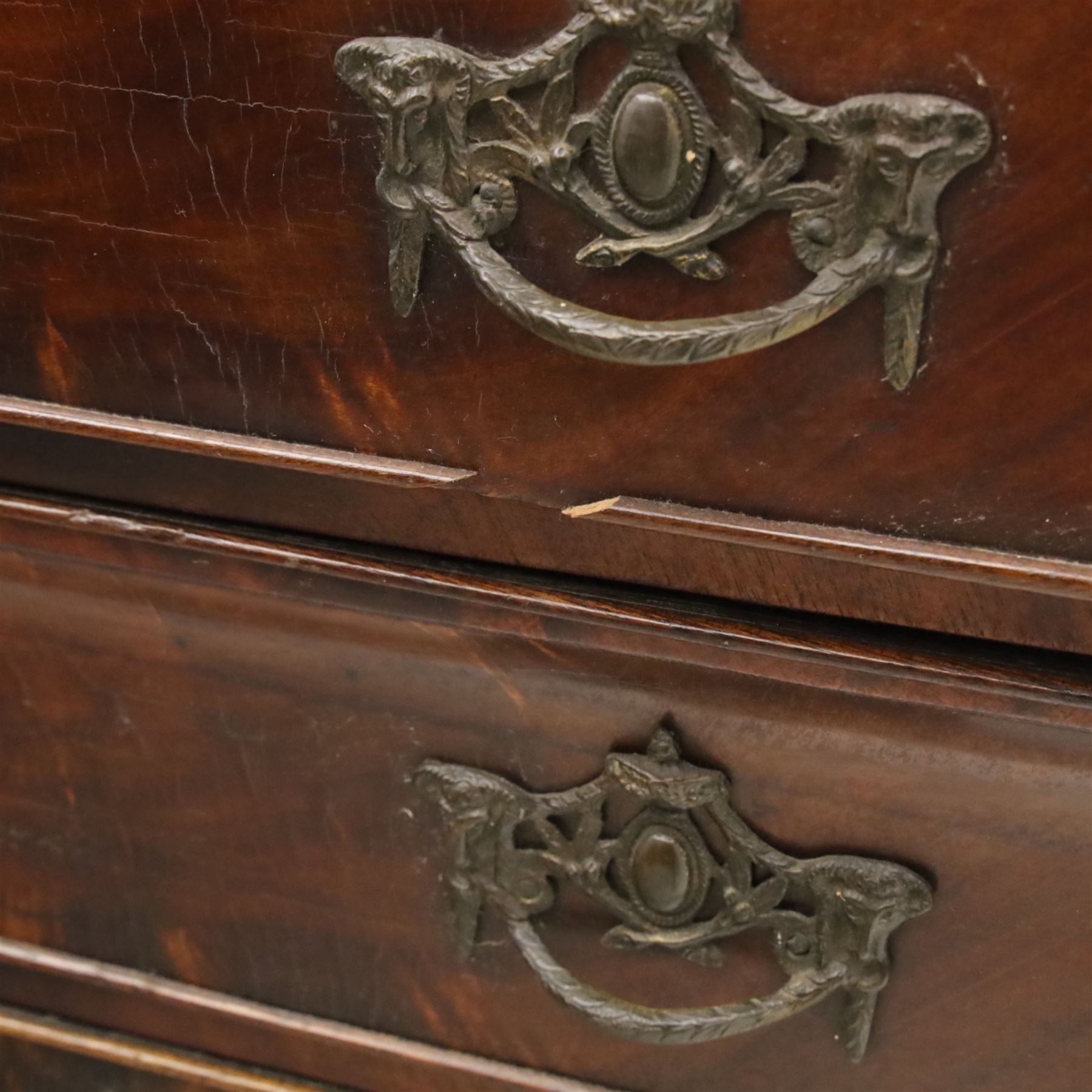 Late 19th century Continental bombe cabinet on chest, shaped moulded cornice with carved cresting, the upper section enclosed by a pair of arched glazed doors with astragal glazing revealing a shelved interior, the lower section fitted with four graduating drawers with rococo-style metal handles, serpentine front and sides, raised on scroll and paw feet