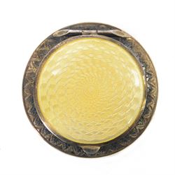 Small French silver gilt compact, with yellow guilloche enamel top and mirror to the under...