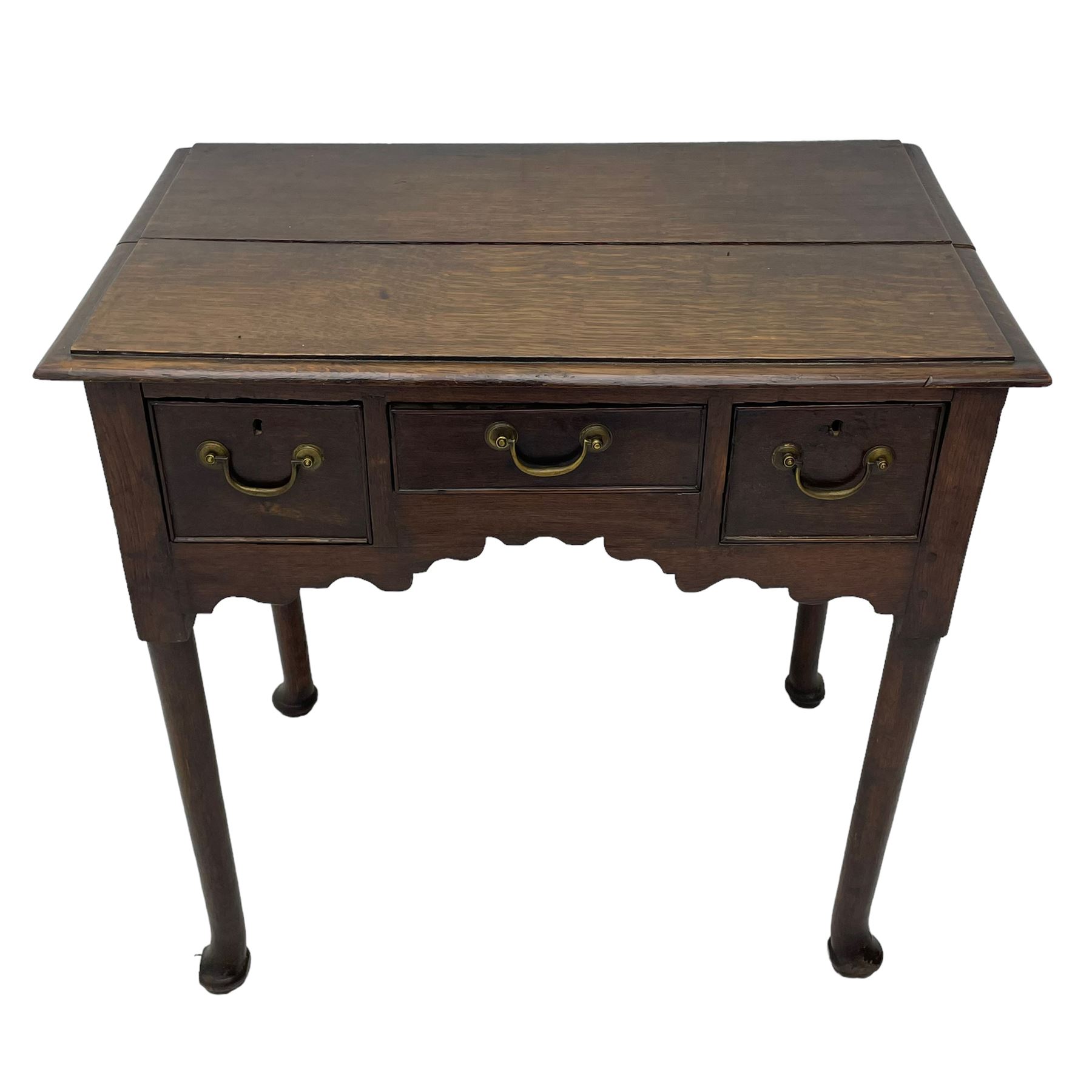 18th century oak low-boy, ovolo-moulded rectangular top over three cock-beaded drawers, circular brass handle plates and D-shaped handles, shaped and stepped arched apron, on cabriole supports 