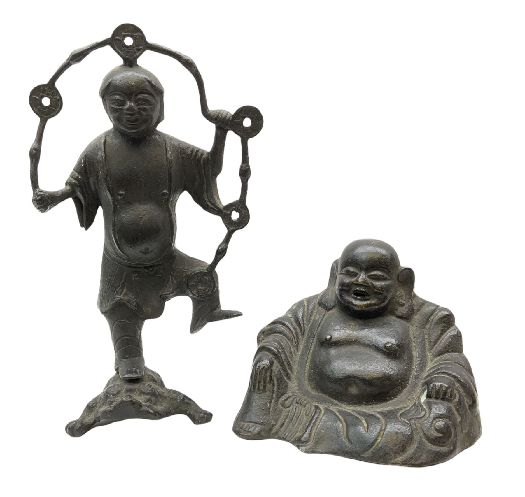Cast iron figure of Liu Hai, the Chinese God of Wealth modelled standing with one foot upon mythical three-legged chánchú toad and holding a string of Chinese coins, H21cm, together with a cast iron figure of a seated laughing Buddha