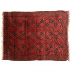 Turkmen Bokhara carpet, with a deep red field and repeating rows of black gul motifs, within multiple geometric borders