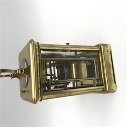 Early 20th century brass five glass carriage clock with button repeater, the brass case engraved with trailing foliage decoration, white enamel Roman dial, eight day movement striking the hours on bell, inscribed 'J. T. Ellsworth from... J. Blundel, Crosby Hall', with key, H14cm