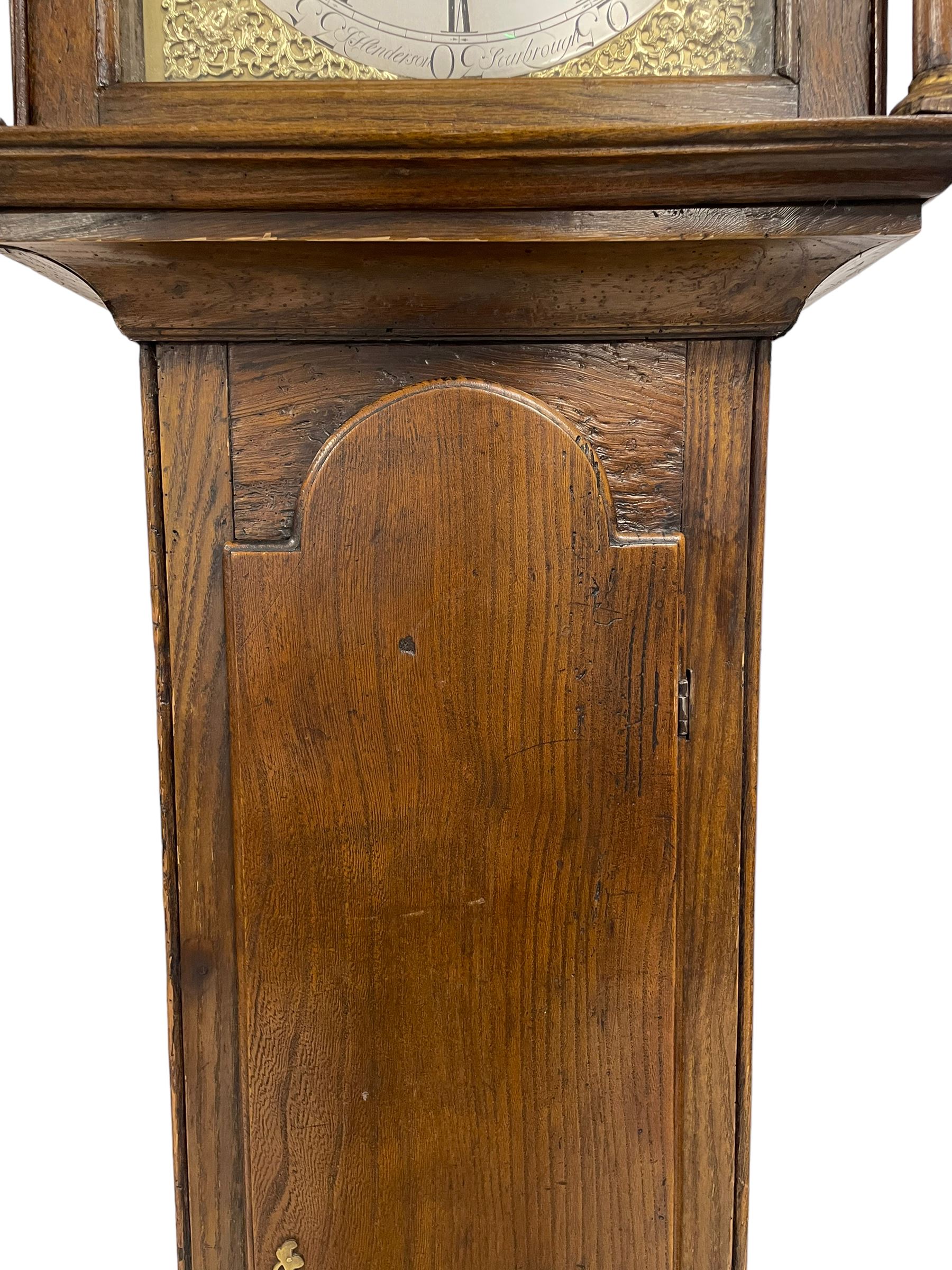 Jeremiah Henderson of Scarborough - 8-day longcase clock in an Elm case c1765,  with a flat top and broad cornice, square hood door flanked by two plain turned pilasters with gesso capitals, long trunk with a conforming door and break arch top, square brass dial with a matted centre, cast spandrels and ringed winding holes, silvered chapter ring with Roman numerals, five minute Arabic's, minute track and finely pierced matching steel hands, dial pinned to a rack striking movement with an anchor escapement. With weights and pendulum. Jeremiah Henderson was the son of Robert Henderson, the first recorded clockmaker in Scarborough. 
