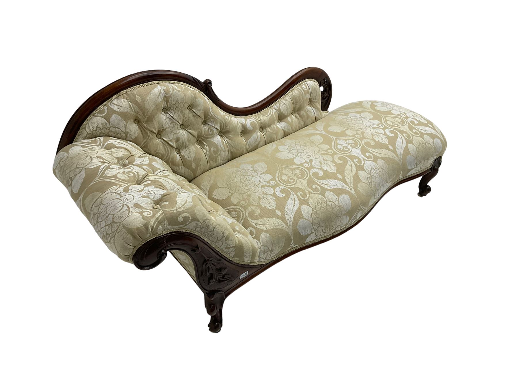 Victorian mahogany chaise longue, scrolled back with pierced and floral carved decoration, champagne foliate pattern fabric, cabriole feet with brass and ceramic castors