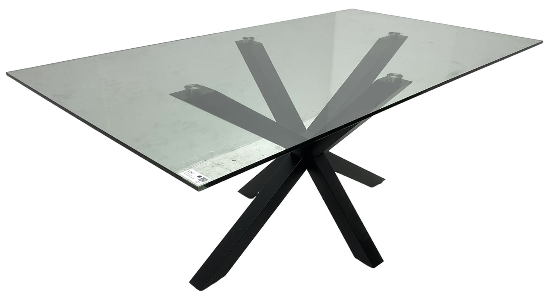 Contemporary glass and metal dining table, rectangular glass top on black finish steel X-framed base