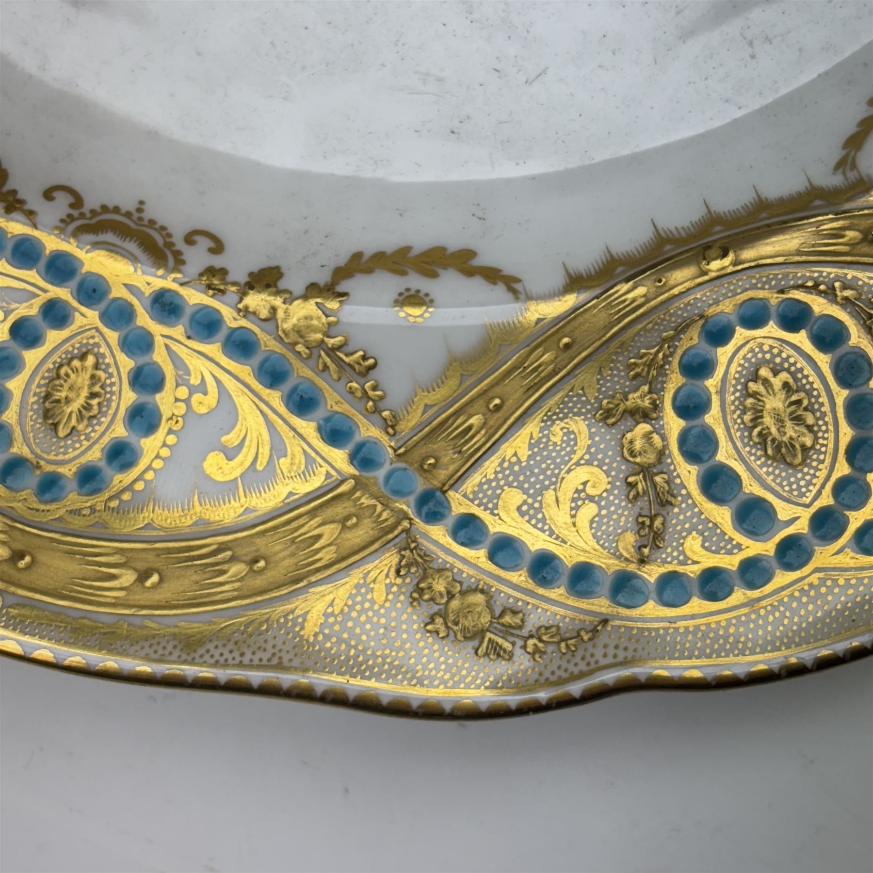 Pair of 19th century H&R Daniel porcelain armorial plates, each decorated with a central painted lion crest and banner inscribed with the Lloyd family motto in Welsh, 'Heb dduw heb ddym, Dhuw a digon' (Without God without anything, God is enough), within a gilt detailed and turquoise jewelled rim, each with puce printed mark verso, D26cm