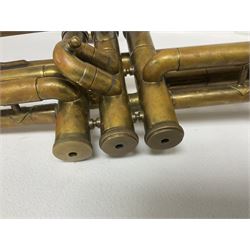 Three brass trombones comprising Elkhart Ind. USA 'CONN' model no.72H; Besson 'Concord'; and Selmer Distributed 'Lincoln'; two in carrying cases; and German B & M 'Champion' brass trumpet (4)
