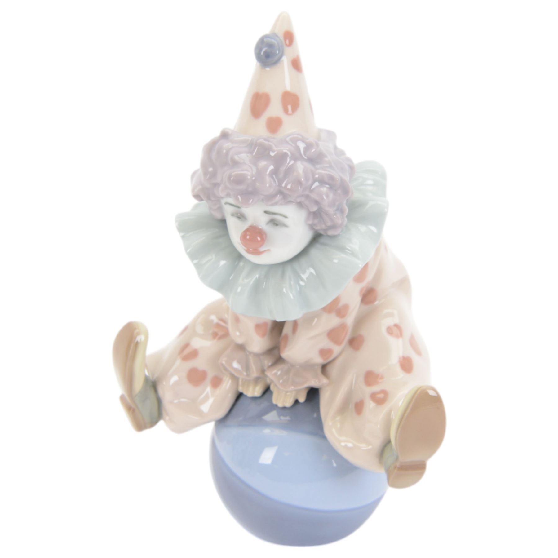 Four Lladro clown figures, comprising Having a Ball 5813, Little Clown 5811, Clown with Puppy 5278 and Pierrot with Concertina 5279