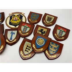 Various European cities and states, wooden heraldic shields each with hand painted raised shield including Baden Wurttemberg, Kunzelsau, City of London, Kingston upon hull etc, seventeen in total. . 