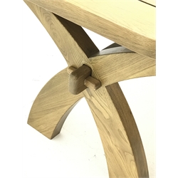  Light oak dining table, extending pull out action top with rounded corners, two fold out leaves, on curved x-shaped supports connected by pegged stretcher (100cm x 180cm (closed) - 280cm (extended)), and set six high back upholstered dining chairs   