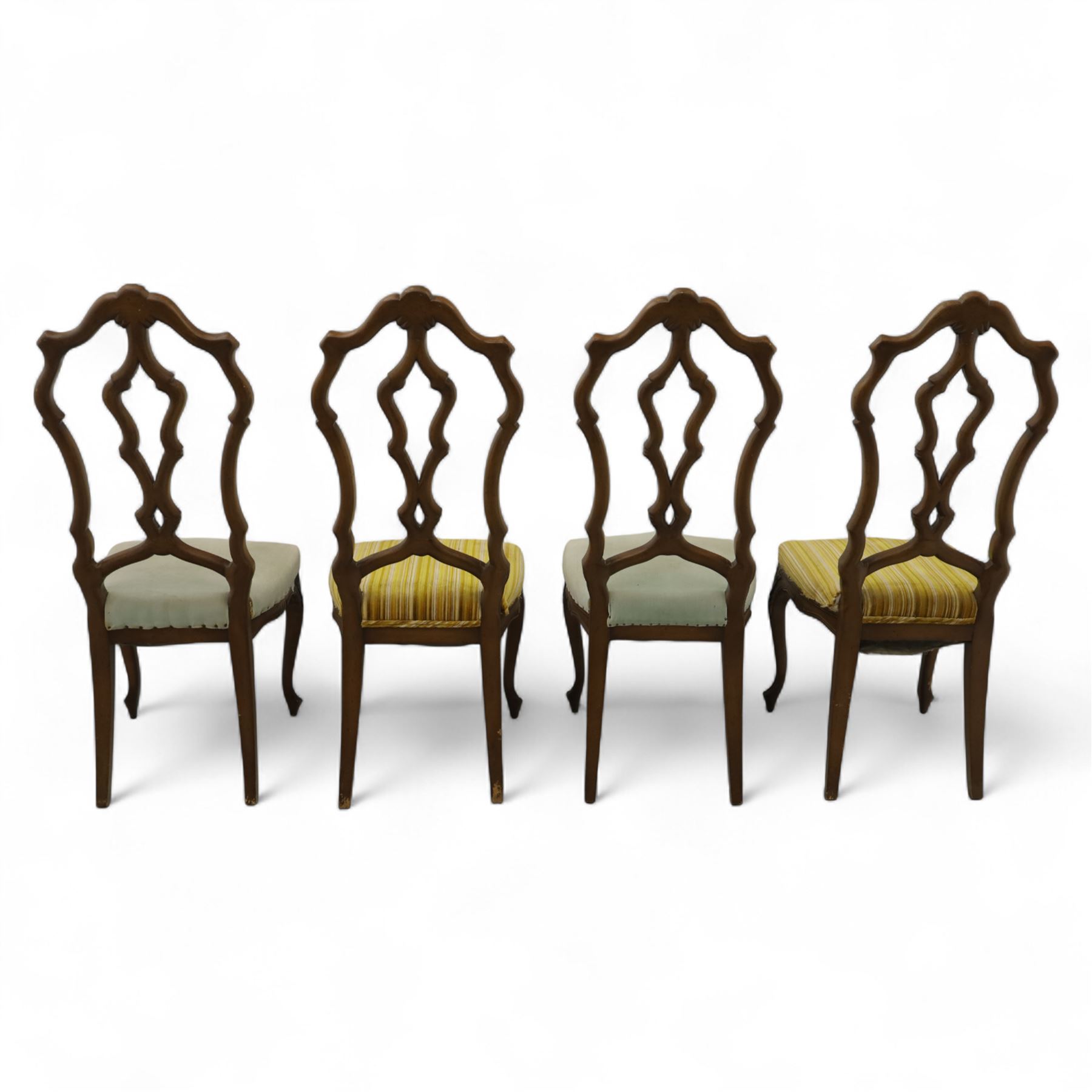 20th-century set of four French provincial-style stained beech dining chairs, pierced cartouche back with fan carving, with a scroll moulded frame above a padded serpentine seat on cabriole legs 