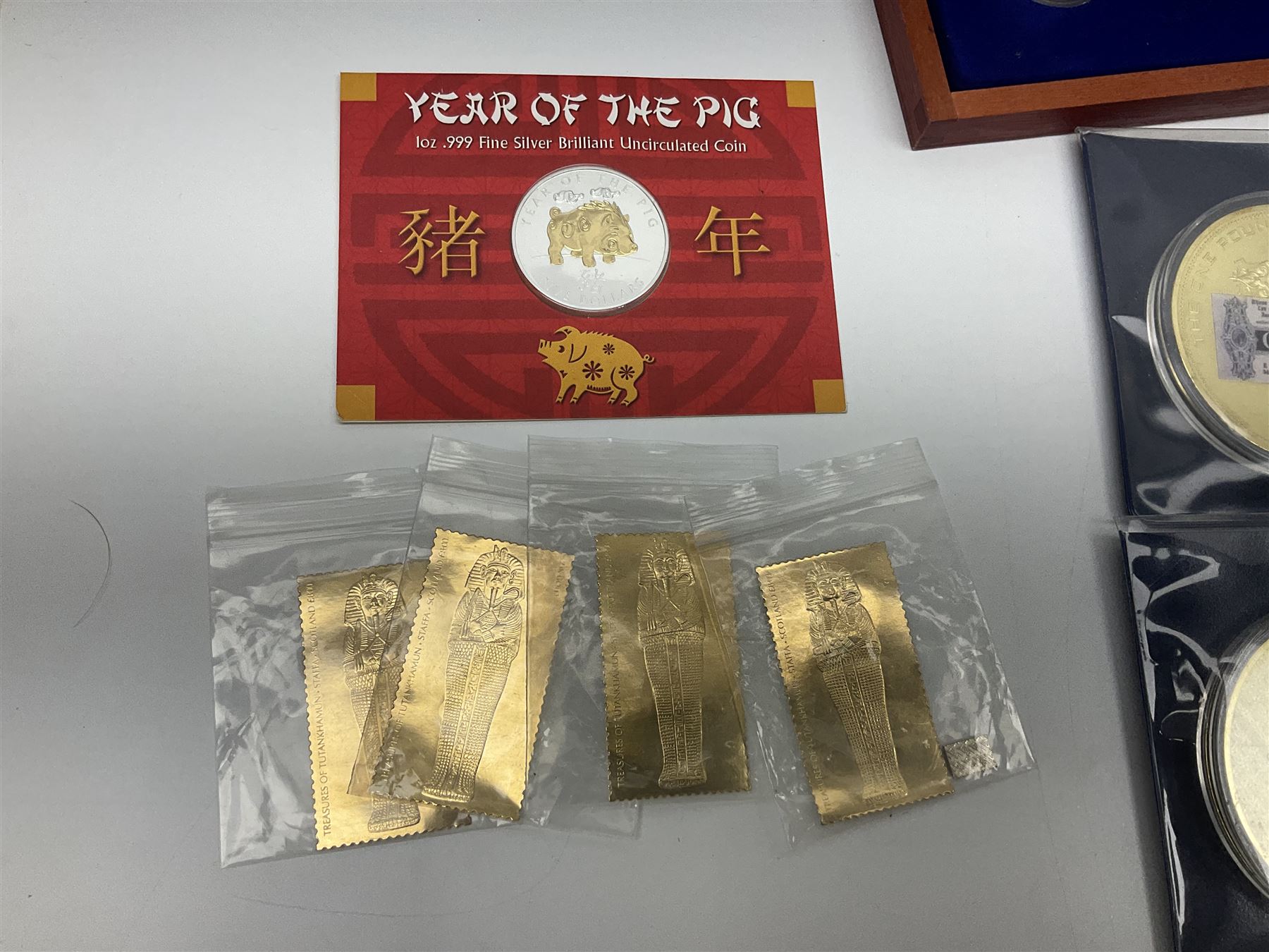 Mostly commemorative and fantasy coinage including commemorative crowns, 2018 'The Capsule Edition featuring the 2018 Paddington 50p coins' in display case, The Royal Mint Solomon Islands 2007 one ounce fine silver five dollars coin on card etc