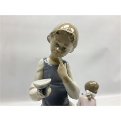 Three Lladro figures, comprising Ironing Time no 5148, Best Friend no 7620 and All Aboard, signed no 7619, largest example H26cm
