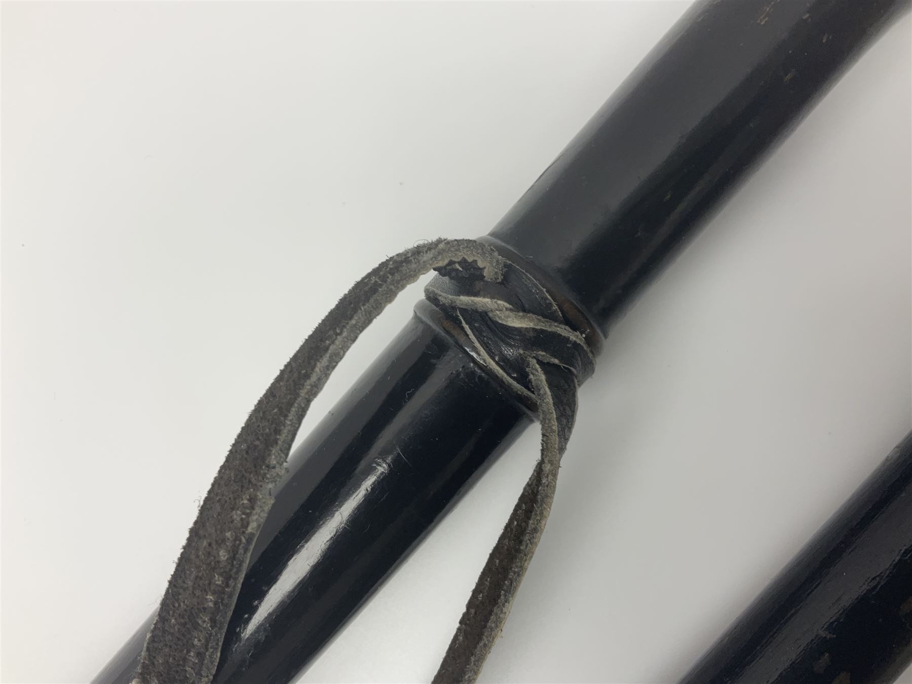 Two ebonised walking sticks, one with 'Leeds City Police' embossed top, tallest H92cm