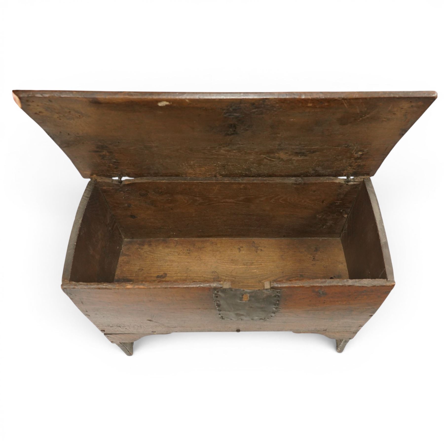 Small 17th century six plank oak coffer, figured top with iron pintle type hinges,  pegged boarded sides, large lock plate with rivets, plank ends continuing down as supports