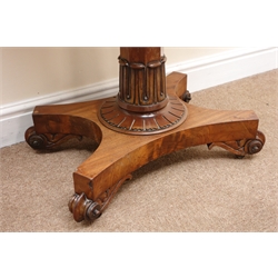 William IV mahogany games table, maroon baize, tapering octagonal column on quatrefoil base, scroll carved feet on castors, W91cm, H75cm, D91cm  