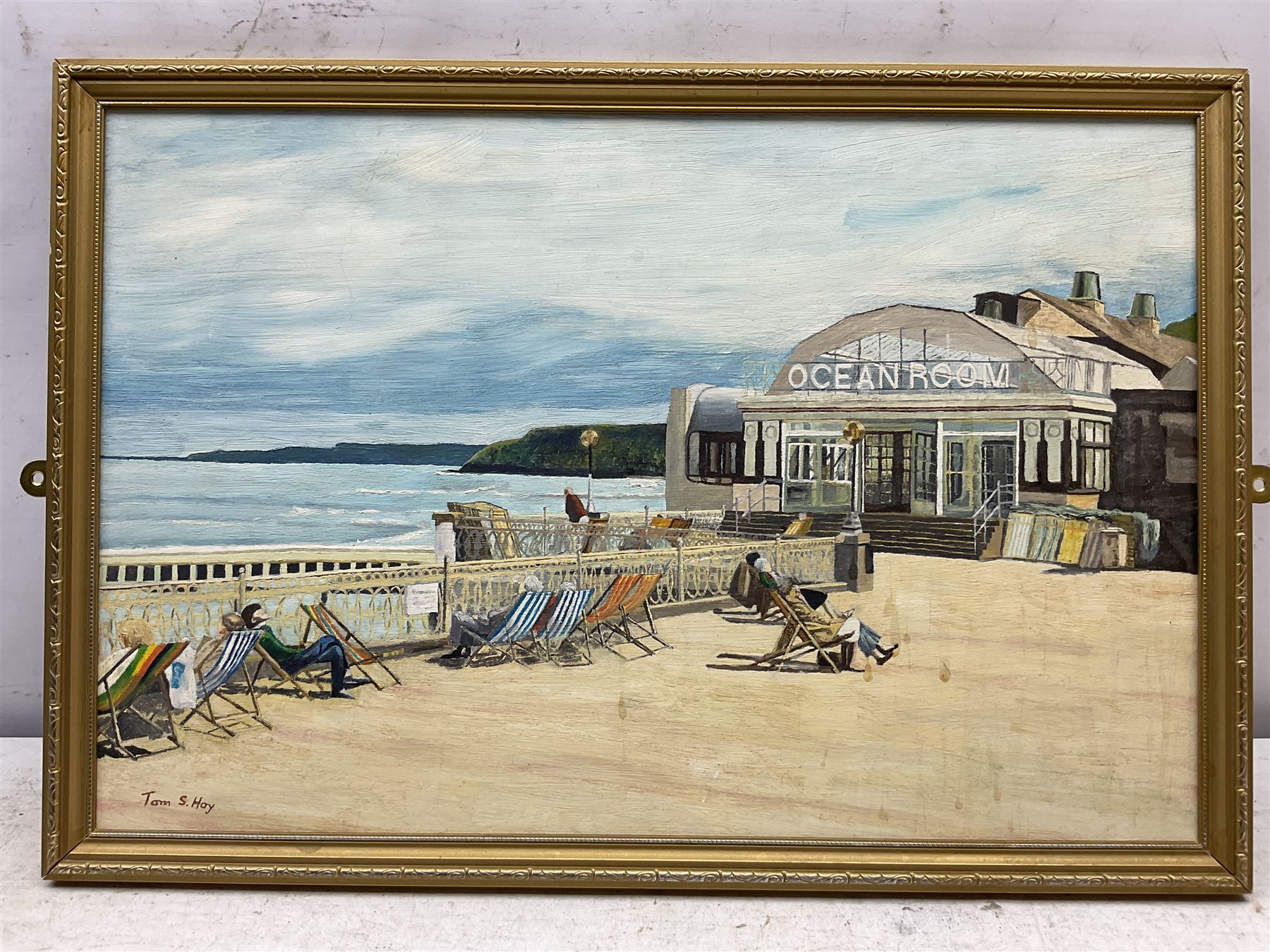Edward H Simpson (British 1901-1989): 'Scarborough South Bay from Cliff Tops', watercolour signed, titled on label verso 35cm x 53cm;Tom S Hoy (British 20th century): Deck Chairs by the Ocean Room, Scarborough Spa, oil on board signed 30cm x 45cm; T Crawford (20th century): Steam and Sail Vessels, oil on board signed 40cm x 50cm (3)