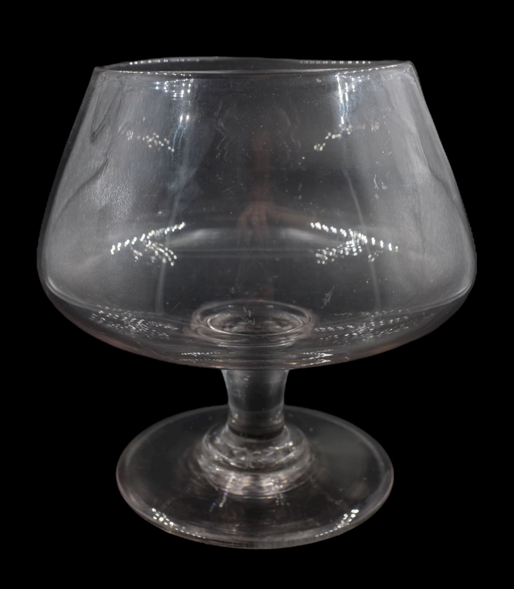 19th century oversized drinking glass, the balloon shaped bowl upon a