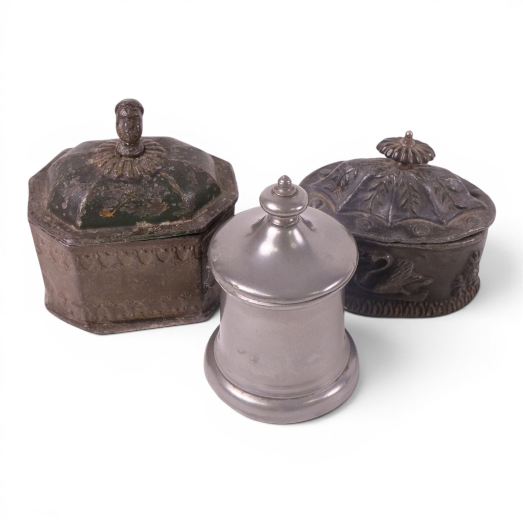 Collection of 19th century and later tobacco jars, including two lead examples, caster iron punch and two others 
