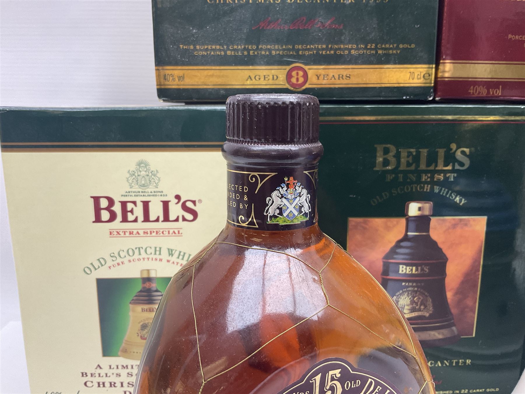 Dimple 15 Year Old Blended Scotch Whisky, together with nine Bells, scotch whisky, in Wade ceramic decanters, including Christmas 1991, 1998, 1996 etc, of various contents and proof 