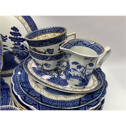 Booths Real Old Willow pattern part tea and dinner service, to include two meat platters, cake stand, teapot, two jugs, sugar bowl, sauce boat, teacups and saucers and a collection of plates and bowls