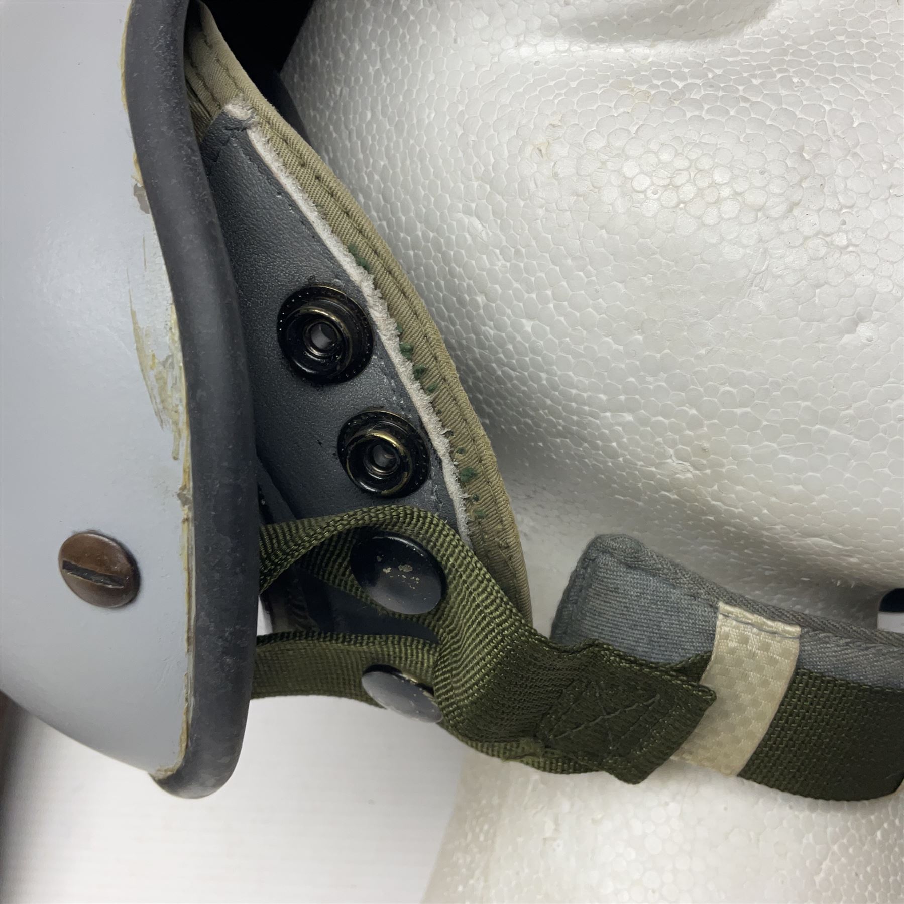 Silver grey SPH-4B Flight Helmet as used by helicopter pilots in the USAF and US Army in the 1990s; made of epoxy resin reinforced fibreglass; fitted with clear and tinted visors and complete with an M-87A/AIC boom mike; original condition and bench tested.