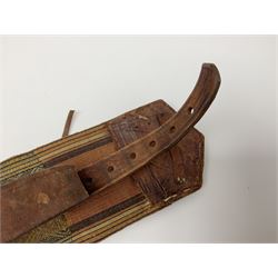 Late 19th century Yemeni Tuza jambiya as worn by religious elite, the 20.5cm curving blade with raised medial ridge, the horn hilt with pique style studwork, in a leather wrapped wooden scabbard with pierced metal mount and leather belt applied with embroidered 'gold' and 'silver' thread work panel; dagger L36cm overall, belt L84cm