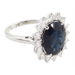 18ct white gold sapphire and diamond cluster ring, single oval cut sapphire of 4.33 carat, with round brilliant cut diamond surround, stamped 750, total diamond weight 0.72 carat