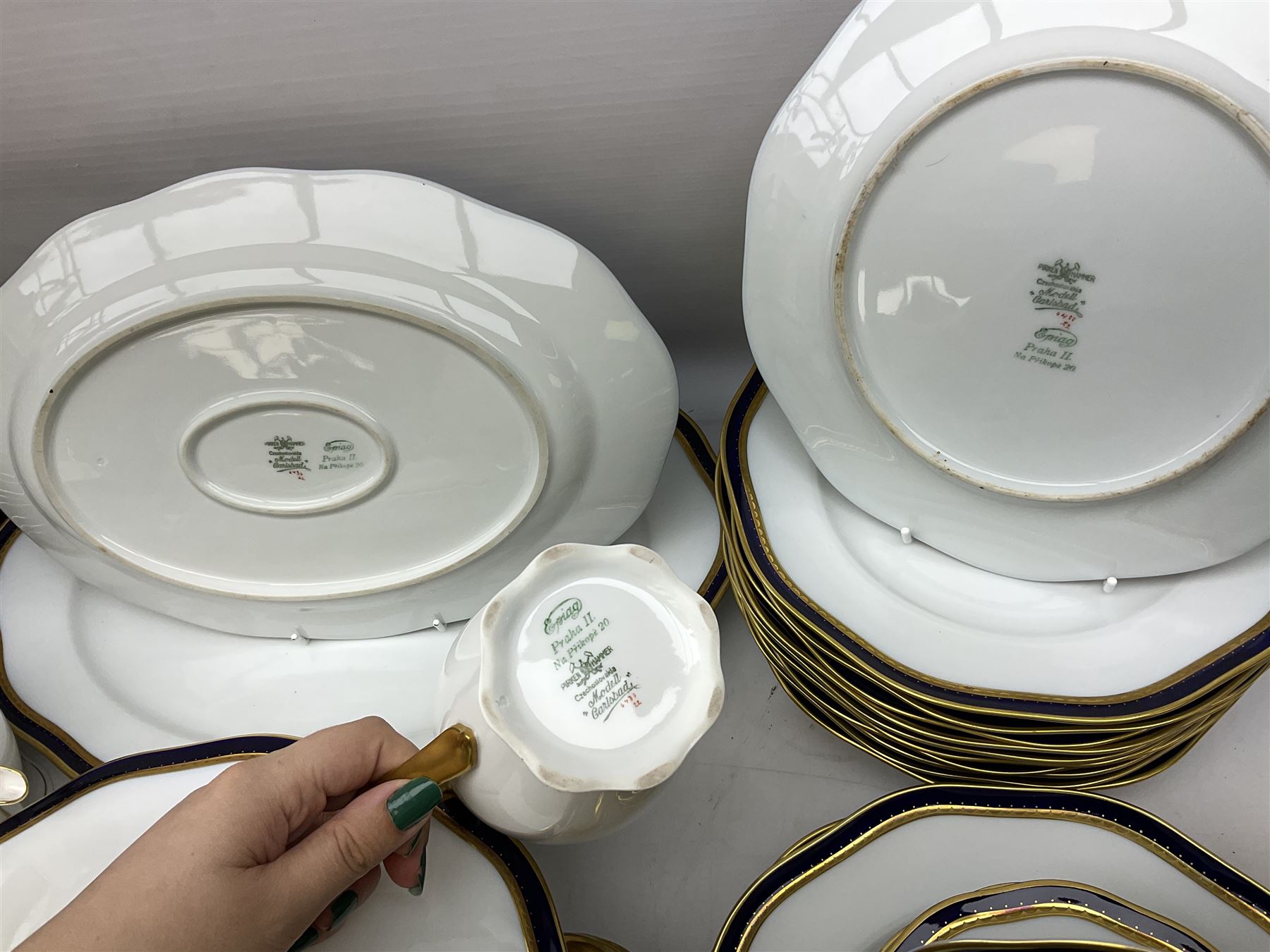 Pirkenhammer of Czechoslovakia Carlsbad pattern tea and dinner for twelve place settings to include dinner plates, soup bowls, side plates, covered tureen, tea cups and saucers, coffee cups and saucers, teapot, milk jug, covered surier, etc, with an addition twelve dinner plates (110)