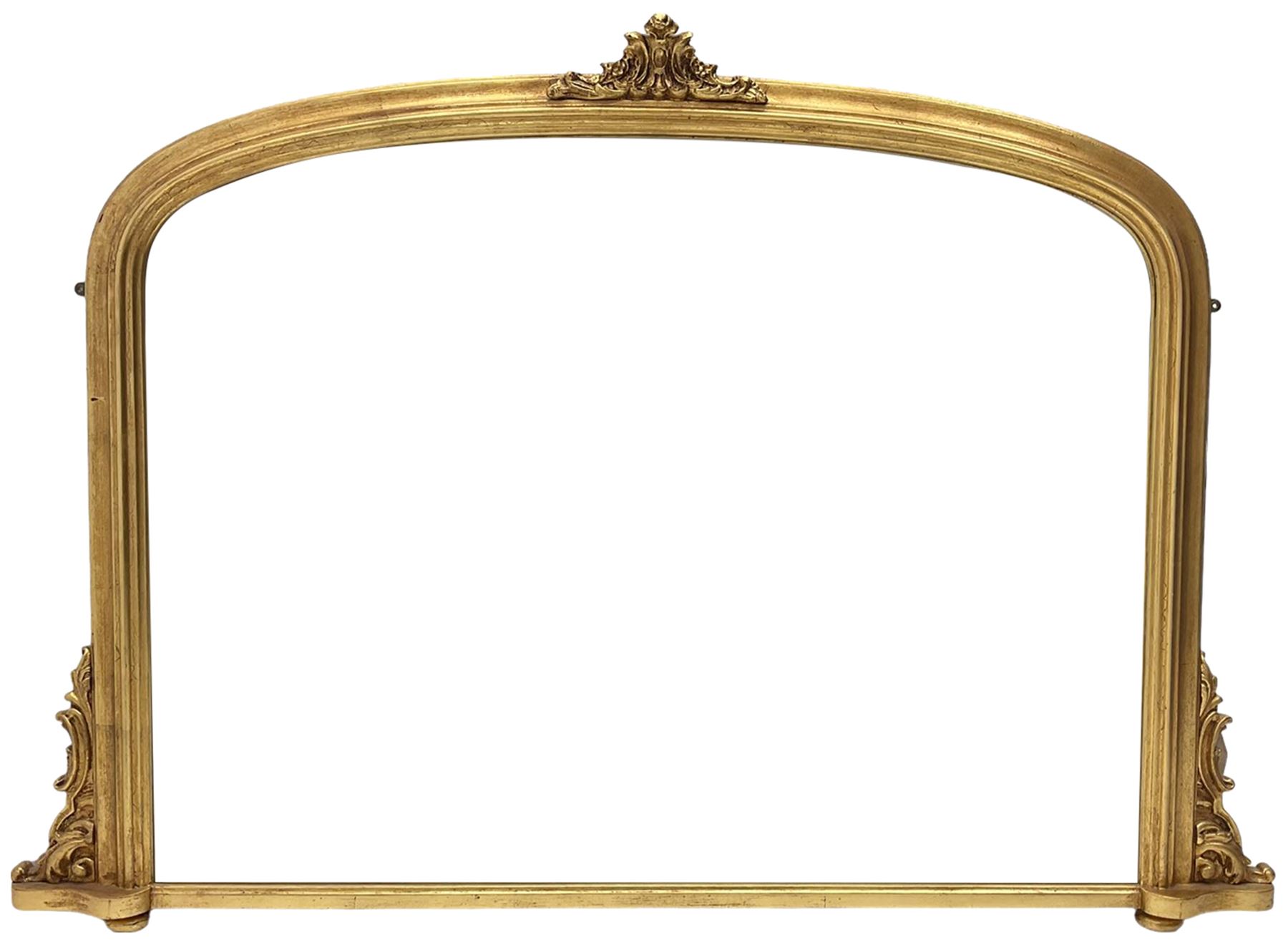 Victorian design gilt overmantel mirror, moulded arched frame with scrolled foliage cartouche pediment and brackets 