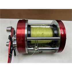 Four Abu fishing reels, comprising Ambassadeur 9000, Ambassadeur 7000, Ambassadeur 5500 and Ambassadeur 6500, together with additional line, hardy fishing bag and two wooden boxes